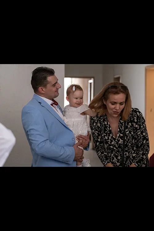 Color wedding photo by Lucas Georgiev. Baby pulls women's hair. Place: Lovech, Bulgaria
