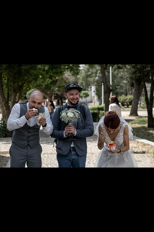 Color wedding photo by Lucas Georgiev. Eating duner kebab in the first free time of the day. Place: Lovech, Bulgaria
