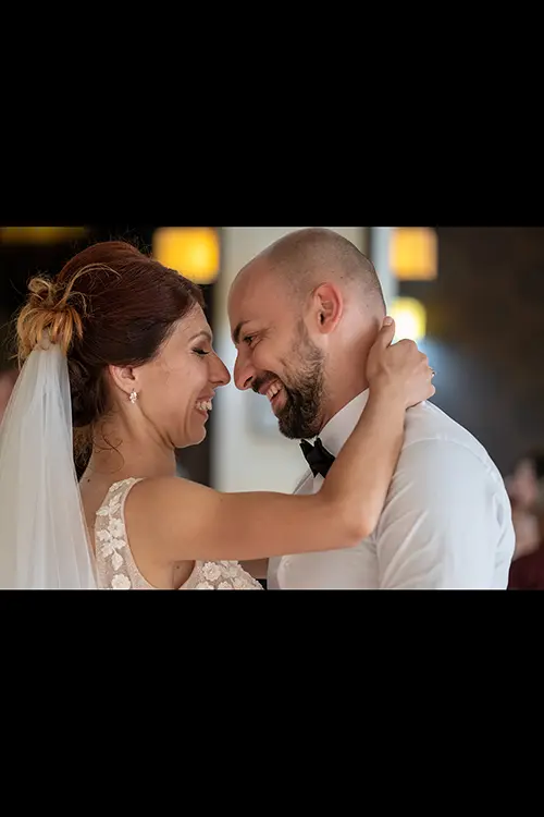 Color wedding photo by Lucas Georgiev. Newlyweds looking each other with love. Place: Lovech, Bulgaria