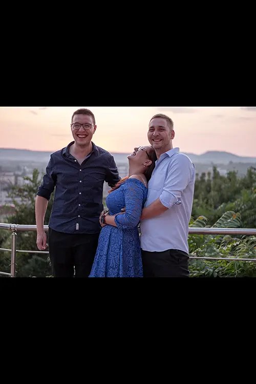 Color wedding photo by Lucas Georgiev. Guests smiling and laughing. Place: Lovech, Bulgaria