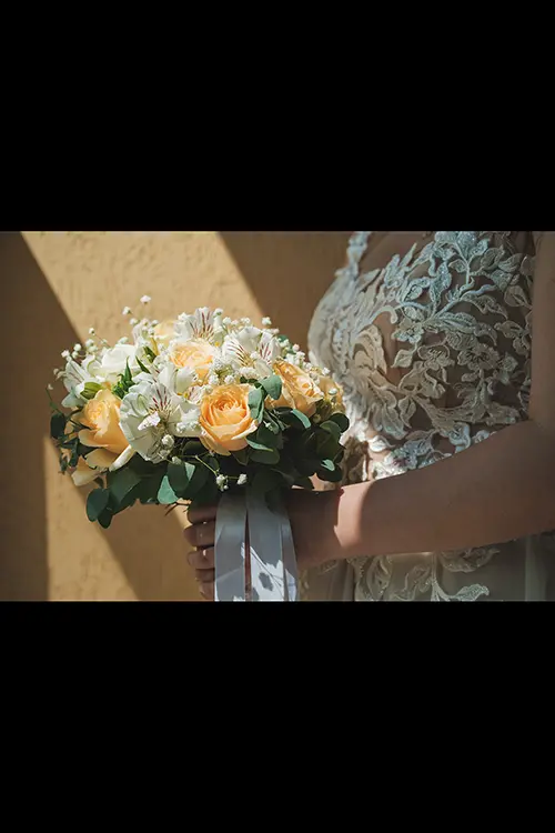 Color wedding photo by Lucas Georgiev. Bouquet with the bride holding it. Place: Trud village, Plovdiv, Bulgaria